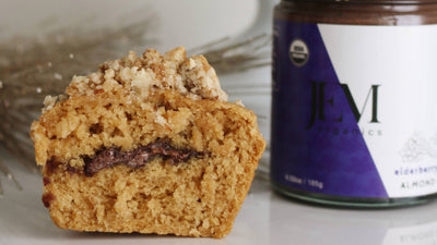 Muffin cut in half filled with JEM Organics Elderberry Cashew Almond Butter