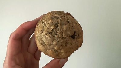 banana chocolate chip muffins held up between fingers
