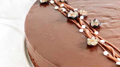 Chocolate ganache pie with grape cake decorations