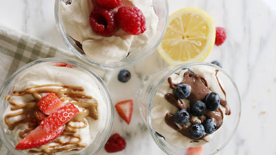 Cheesecake cups on a marble counter