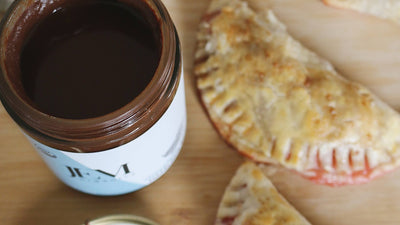 Strawberry empanada next to JEM Organics Chocolate Hazelnut Butter