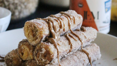 French toast roll ups stacked in a pyramid