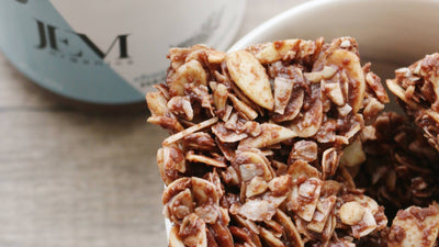 granola cookies in a bowl next to a jar of JEM Organics