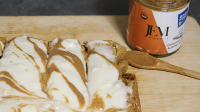 Gingerbread bars covered in cream cheese frosting and JEM Organics Nut Butter