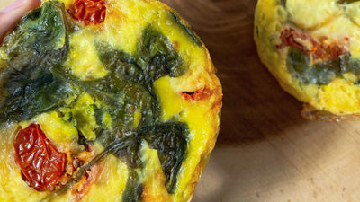 Small bite size homemade quiches with spinach